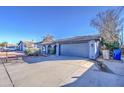 House exterior showcasing a driveway and a two-car garage at 6355 W Caron St, Glendale, AZ 85302