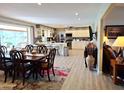 Eat-in kitchen with white cabinets, island, and view to backyard at 7813 E Lakeview Ave, Mesa, AZ 85209