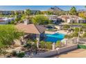 Community pool and spa with a covered patio area at 8100 E Camelback Rd # 175, Scottsdale, AZ 85251