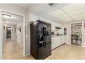 Kitchen features black appliances and ample cabinet space at 9403 W Fern Dr, Sun City, AZ 85351