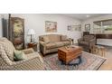 Cozy living room with hardwood floors and comfortable furniture at 9403 W Fern Dr, Sun City, AZ 85351