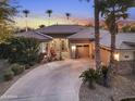 Attractive single-Gathering home boasting a circular driveway, desert landscaping, and a welcoming front porch at 953 E Fieldstone Pl, Chandler, AZ 85249