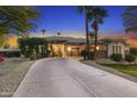 Lovely single-story home featuring desert landscaping, mature palm trees, and a circular driveway at 953 E Fieldstone Pl, Chandler, AZ 85249