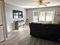 Spacious living room with hardwood floors and access to a patio at 2121 W Union Hills Dr # 115, Phoenix, AZ 85027
