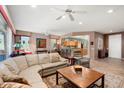 Open concept living area with ample natural light and comfortable seating at 21364 N Redington Point Dr, Surprise, AZ 85387