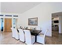 Elegant dining room with a large table and seating for eight at 23335 N Country Club Trl, Scottsdale, AZ 85255