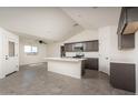 Spacious kitchen featuring an island, modern cabinetry, and tile flooring at 24520 W Duane Ln, Wittmann, AZ 85361