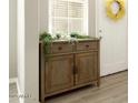 Simple entryway with a wooden console table and greenery at 3146 E Sagebrush St, Gilbert, AZ 85296