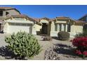 Single-story home with desert landscaping and a two-car garage at 34649 N Vidlak Dr, San Tan Valley, AZ 85143