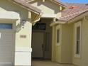 Front entrance with tiled walkway and decorative lighting at 34649 N Vidlak Dr, San Tan Valley, AZ 85143