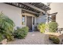 Front entry with wrought iron door and pergola at 37202 N Holiday Ln, Carefree, AZ 85377