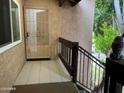 Ground level entry with security door and tiled flooring at 520 N Stapley Dr # 290, Mesa, AZ 85203