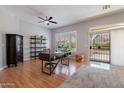 Bright home office with built-in shelving and hardwood floors at 5363 S Emerald Desert Dr, Gold Canyon, AZ 85118