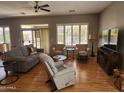 Spacious living room with hardwood floors, ceiling fan and ample seating at 5363 S Emerald Desert Dr, Gold Canyon, AZ 85118