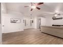 Bright living room with hardwood floors and neutral walls at 5715 N 105Th Ln, Glendale, AZ 85307