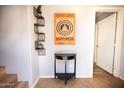 Home entryway with half-moon table and eclectic wall art at 9233 E Neville Ave # 1131, Mesa, AZ 85209