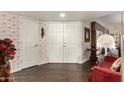 Bright entryway with hardwood floors and unique wallpaper at 10814 W Thunderbird Blvd, Sun City, AZ 85351