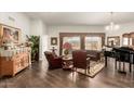 Spacious living room with hardwood floors and ample natural light at 10814 W Thunderbird Blvd, Sun City, AZ 85351