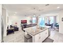 Modern kitchen with granite countertops and island at 12668 W Orangewood Ave, Glendale, AZ 85307