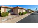 View of multiple tan single story homes with landscaping at 13232 N 98Th Ave # N, Sun City, AZ 85351