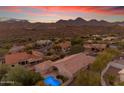 Aerial view of a house with a pool and mountain views at 15859 N Nyack Dr, Fountain Hills, AZ 85268