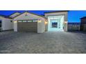 Spacious 3-car garage with extended workshop area at 16871 W Cielo Grande Ave, Surprise, AZ 85387