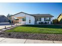 Updated single story home with well-manicured lawn at 1860 S 24Th St, Mesa, AZ 85204