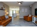 Bright living room featuring leather sofas and kitchen views at 1860 S 24Th St, Mesa, AZ 85204