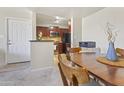 Cozy dining area with a view into the kitchen at 1880 E Morten Ave # 206, Phoenix, AZ 85020