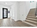 Bright entryway with tile floors and staircase at 21002 E Mayberry Rd, Queen Creek, AZ 85142