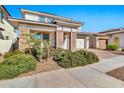 Two-story home with stone accents and a two-car garage at 21002 E Mayberry Rd, Queen Creek, AZ 85142