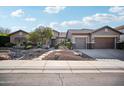 Single-story home with two-car garage and desert landscaping at 2207 W Hidden Treasure Way, Phoenix, AZ 85086