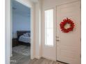 Entryway with view into bedroom and decorative wreath at 2408 N Morrison Ave, Casa Grande, AZ 85122