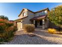 Two-story house with tan exterior, brown roof, and a two-car garage at 3496 E Anika Ct, Gilbert, AZ 85298