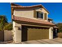 Two-story house with tan exterior, brown roof, and a two-car garage at 3496 E Anika Ct, Gilbert, AZ 85298