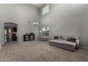 Spacious living room with high ceilings and a gray couch at 3496 E Anika Ct, Gilbert, AZ 85298