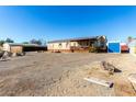 Single-wide manufactured home with solar panels and a storage shed at 3810 W Mohawk Ln, Glendale, AZ 85308