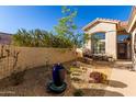 Landscaped front yard with fountain and walkway leading to entrance at 3818 N Lomond Cir, Mesa, AZ 85215