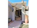 Inviting entrance with a wrought iron gate and pergola at 5100 N Miller Rd # 20, Scottsdale, AZ 85250