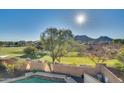 Stunning view of a backyard pool with mountain backdrop at 5227 W Desperado Way, Phoenix, AZ 85083