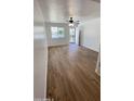 Bright and airy living room with new wood-look floors at 5712 N 63Rd Ave, Glendale, AZ 85301