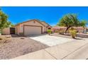 House with a two-car garage and a gated side yard at 603 W Sierra Vista Dr, Apache Junction, AZ 85120