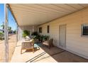 Covered patio furnished with comfortable seating at 630 S 93Rd Pl, Mesa, AZ 85208