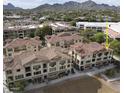 Luxury community near mountains, featuring multiple buildings with Spanish-style architecture at 7275 N Scottsdale Rd # 1001, Paradise Valley, AZ 85253