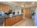 Kitchen with granite island and access to laundry at 8013 N Via Palma St, Scottsdale, AZ 85258