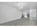 Bright dining area with tile floors and chandelier at 1135 E Westwood Dr, Casa Grande, AZ 85122