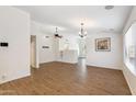Spacious living room with wood-look floors, ceiling fan, and lots of natural light at 1328 E Binner Dr, Chandler, AZ 85225
