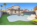 Inviting backyard with a swimming pool and a covered patio at 1436 E Rosemonte Dr, Phoenix, AZ 85024