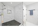 Updated shower with marble tile and a built-in shelf at 1436 E Rosemonte Dr, Phoenix, AZ 85024