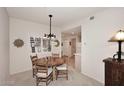 Charming dining room with round table and four chairs, near kitchen at 15050 N Thompson Peak Pkwy # 1010, Scottsdale, AZ 85260